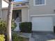 Charming townhome featuring an attached single car garage and a welcoming, elevated front entrance at 6821 Fairview Ter # 6821, Bradenton, FL 34203