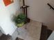 Welcoming foyer area with tiled flooring, a potted plant, and a staircase leading up at 6821 Fairview Ter # 6821, Bradenton, FL 34203