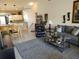 Open-concept living room featuring comfortable seating, a ceiling fan, and kitchen access at 6821 Fairview Ter # 6821, Bradenton, FL 34203