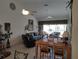 Spacious living room and dining area with high ceilings and comfortable seating at 6821 Fairview Ter # 6821, Bradenton, FL 34203