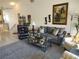 Cozy living room with comfortable seating, a ceiling fan, and tasteful decor at 6821 Fairview Ter # 6821, Bradenton, FL 34203