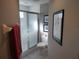 Clean and bright bathroom featuring a glass-enclosed shower and tiled floor at 6821 Fairview Ter # 6821, Bradenton, FL 34203