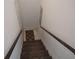 Carpeted stairway with wooden handrails leading up or down at 6821 Fairview Ter # 6821, Bradenton, FL 34203