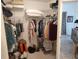 Well-organized walk-in closet with shelving and hanging space at 6821 Fairview Ter # 6821, Bradenton, FL 34203