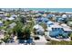 Aerial view of a charming home with lush landscaping, nestled in a coastal community at 709 Fern, Anna Maria, FL 34216