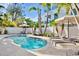 Private pool area with lounge chairs and lush tropical landscaping at 709 Fern, Anna Maria, FL 34216