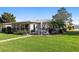 Spacious backyard with lush lawn and patio, ideal for outdoor living and enjoying the landscape at 7122 11Th W Ave, Bradenton, FL 34209