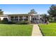 Well-maintained backyard showcasing a patio area and expansive lawn, perfect for relaxation at 7122 11Th W Ave, Bradenton, FL 34209