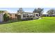 Lush backyard with a well manicured lawn, a great space to relax and enjoy outdoors at 7122 11Th W Ave, Bradenton, FL 34209