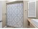 Bathroom featuring a shower with curtain, sink, mirror and cabinet at 7122 11Th W Ave, Bradenton, FL 34209