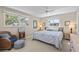 Bright bedroom with neutral colors featuring a ceiling fan and multiple windows at 7122 11Th W Ave, Bradenton, FL 34209