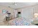 Bedroom features a ceiling fan, desk, TV, and a comfortable bed at 7122 11Th W Ave, Bradenton, FL 34209