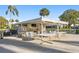 Community cabana with BBQ, outdoor seating, and a mounted TV for resident enjoyment at 7122 11Th W Ave, Bradenton, FL 34209