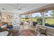 Living room with scenic views featuring large windows, comfortable seating, and bright sunlight at 7122 11Th W Ave, Bradenton, FL 34209