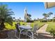 Charming patio with table and chairs, perfect for enjoying the well-maintained community views at 7122 11Th W Ave, Bradenton, FL 34209