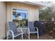 Relaxing patio with seating and a grill, perfect for outdoor entertaining in a serene setting at 7122 11Th W Ave, Bradenton, FL 34209