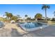 Large community pool with lounge seating and lush landscaping at 7122 11Th W Ave, Bradenton, FL 34209