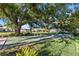 Community shuffleboard court nestled beneath a large shade tree at 7122 11Th W Ave, Bradenton, FL 34209