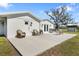 Outdoor patio featuring comfortable wicker seating and a built-in grill, perfect for entertaining and enjoying the backyard at 7150 Richardson Rd, Sarasota, FL 34240