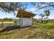 Exterior view of a barn structure, featuring metal siding and a covered area, perfect for equipment storage or livestock at 7150 Richardson Rd, Sarasota, FL 34240