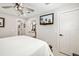 Bedroom featuring white walls, a door to the bathroom, and a queen size bed at 7150 Richardson Rd, Sarasota, FL 34240