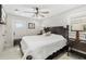 Bedroom with white walls, ceiling fan, a TV, and a queen size bed at 7150 Richardson Rd, Sarasota, FL 34240
