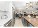 Bright kitchen with stainless appliances and a center island that opens to the dining area at 7150 Richardson Rd, Sarasota, FL 34240