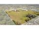 Aerial view of the property outlining the property lines, showcasing land with an expansive metal storage building at 7150 Richardson Rd, Sarasota, FL 34240