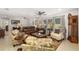 Bright and airy living room with a neutral color palette, wood accents, and comfortable seating creates inviting space at 7150 Richardson Rd, Sarasota, FL 34240