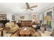 Spacious living room features a warm color palette, comfortable seating, and decorative accents, perfect for relaxing at 7150 Richardson Rd, Sarasota, FL 34240
