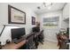 Office featuring neutral walls, a window, desks, and multiple computer monitors at 7150 Richardson Rd, Sarasota, FL 34240