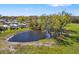 Picturesque pond surrounded by lush greenery, creating a tranquil and natural setting at 7150 Richardson Rd, Sarasota, FL 34240
