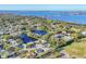 Sweeping aerial view of a waterfront community with lush greenery, ponds, and clear blue skies at 7612 4Th Avenue Nw Dr, Bradenton, FL 34209