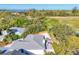 Beautiful home featuring a metal roof, an outdoor patio area, and lush landscaping from above at 7612 4Th Avenue Nw Dr, Bradenton, FL 34209