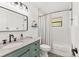 Beautiful bathroom features a granite countertop, patterned tile floor, and shower with subway tile surround at 7612 4Th Avenue Nw Dr, Bradenton, FL 34209