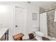 Modern bathroom featuring a stylish shower, toilet and a wooden shower stool at 7612 4Th Avenue Nw Dr, Bradenton, FL 34209
