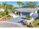 Beautiful single-story home with lush landscaping, a brick driveway, and a tranquil atmosphere at 7612 4Th Avenue Nw Dr, Bradenton, FL 34209