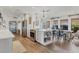 Bright kitchen with a central island, stainless steel appliances, and an open layout to the dining space at 7612 4Th Avenue Nw Dr, Bradenton, FL 34209