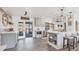 Open-concept kitchen with an island, stainless steel appliances, and an adjacent dining area at 7612 4Th Avenue Nw Dr, Bradenton, FL 34209