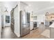 Spacious kitchen featuring stainless steel appliances, an open layout, and hardwood flooring at 7612 4Th Avenue Nw Dr, Bradenton, FL 34209