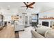 Bright, airy living room with a fireplace, neutral furniture, and hardwood floors throughout at 7612 4Th Avenue Nw Dr, Bradenton, FL 34209