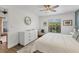 Airy main bedroom featuring wood floors, a ceiling fan and a sunlit window at 7612 4Th Avenue Nw Dr, Bradenton, FL 34209