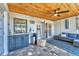 Entertaining patio area features a wooden ceiling, outdoor seating, and a stylish refreshment center at 7612 4Th Avenue Nw Dr, Bradenton, FL 34209