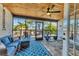 Relaxing screened-in patio with comfortable seating and an outdoor ceiling fan to stay cool at 7612 4Th Avenue Nw Dr, Bradenton, FL 34209