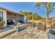 Private backyard featuring a brick patio, outdoor seating, and lush landscaping at 7612 4Th Avenue Nw Dr, Bradenton, FL 34209