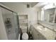 Bathroom with walk-in shower, vanity, and built-in storage cabinet at 3900 Roxane Blvd # 10A, Sarasota, FL 34235