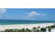 View of the beach, ocean, and blue sky from a high rise balcony at 1080 Peppertree W Ln # 602, Sarasota, FL 34242