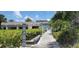 Community access to the beach, surrounded by lush landscaping at 1080 Peppertree W Ln # 602, Sarasota, FL 34242