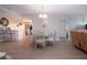 Chic dining room featuring modern table and chairs, open layout, and stylish lighting at 1080 Peppertree W Ln # 602, Sarasota, FL 34242