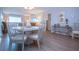 Cozy dining room with white table and chairs at 1080 Peppertree W Ln # 602, Sarasota, FL 34242